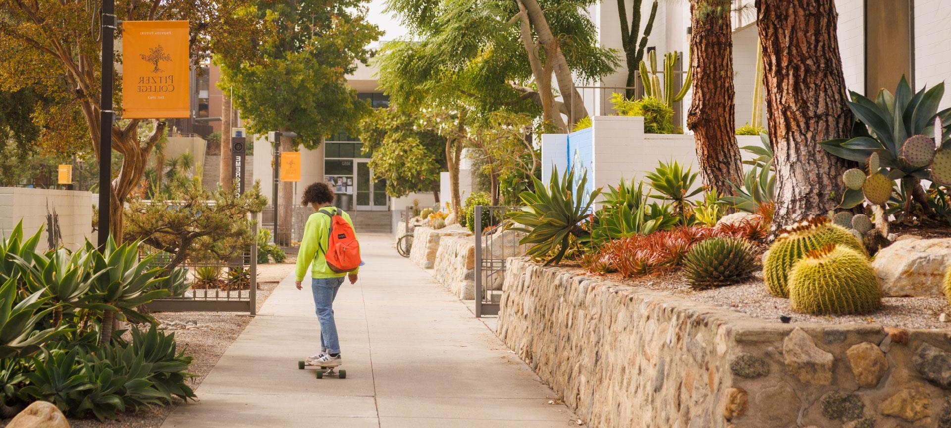 student skateboarding near mead hall